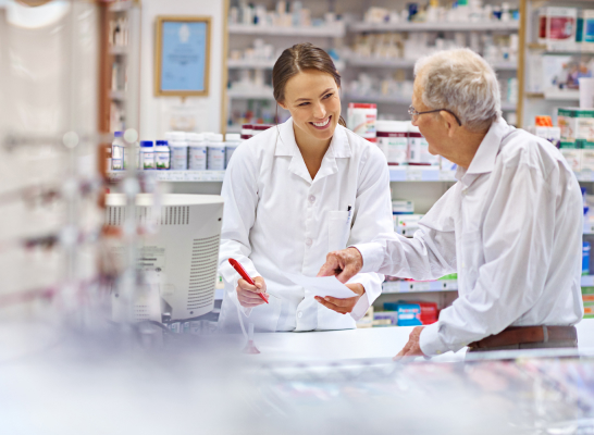 Pharmacist Helping Senior Customer
